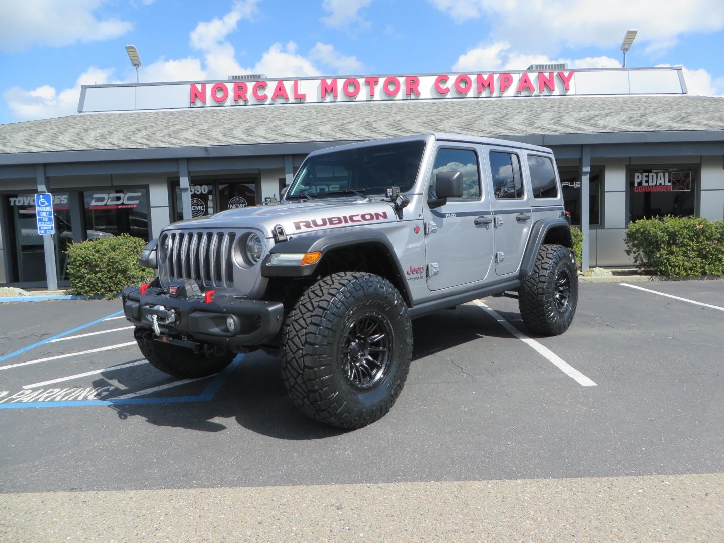 2021 SILVER /BLACK Jeep Wrangler Unlimited Rubicon (1C4HJXFG7MW) with an 3.6L V6 DOHC 24V FFV engine, 6A transmission, located at 2630 Grass Valley Highway, Auburn, CA, 95603, (530) 508-5100, 38.937893, -121.095482 - Features - Zone Offroad 3" Lift kit, Fox shocks, 37" Nitto Ridge Grappler tires, 17" Fuel Piston wheels, Warn winch, KC led lights, Voswitch switches, Teraflex HD tire relocation, Fire extinguisher, High Lift Jack, Shovel, Axe, Jumper Cables, and flat towable. - Photo#0